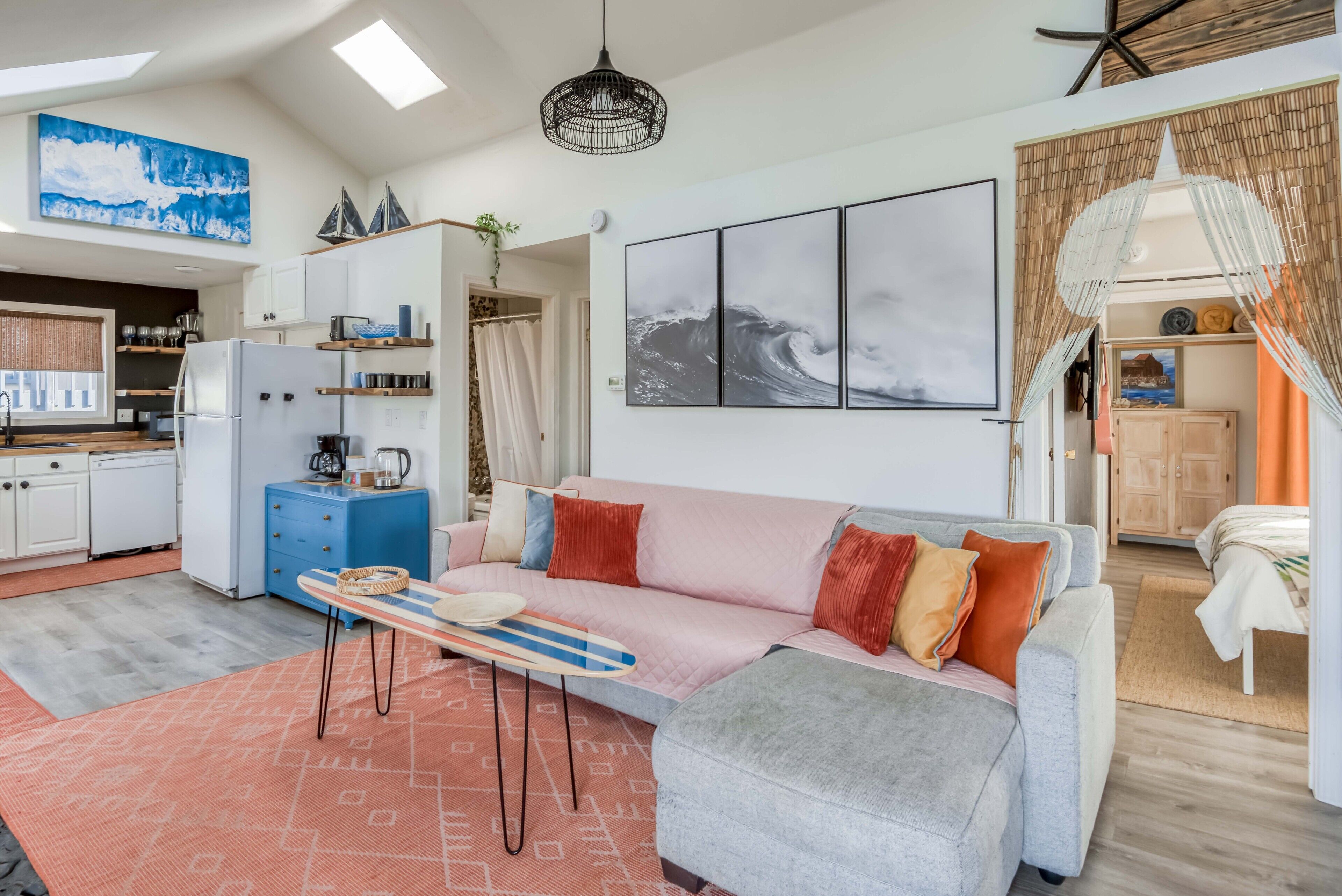 Adorable beachy cottage with a rock chimney is only ½ block from the beach!