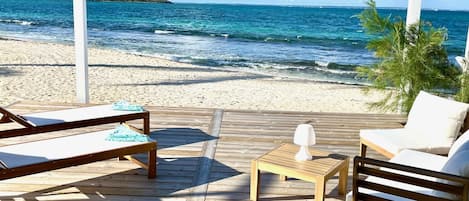 On the beach, sun loungers, beach towels
