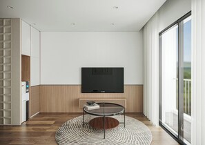 디럭스 아파트 | 거실 공간 | 위성 채널 시청이 가능한 50인치 LED TV