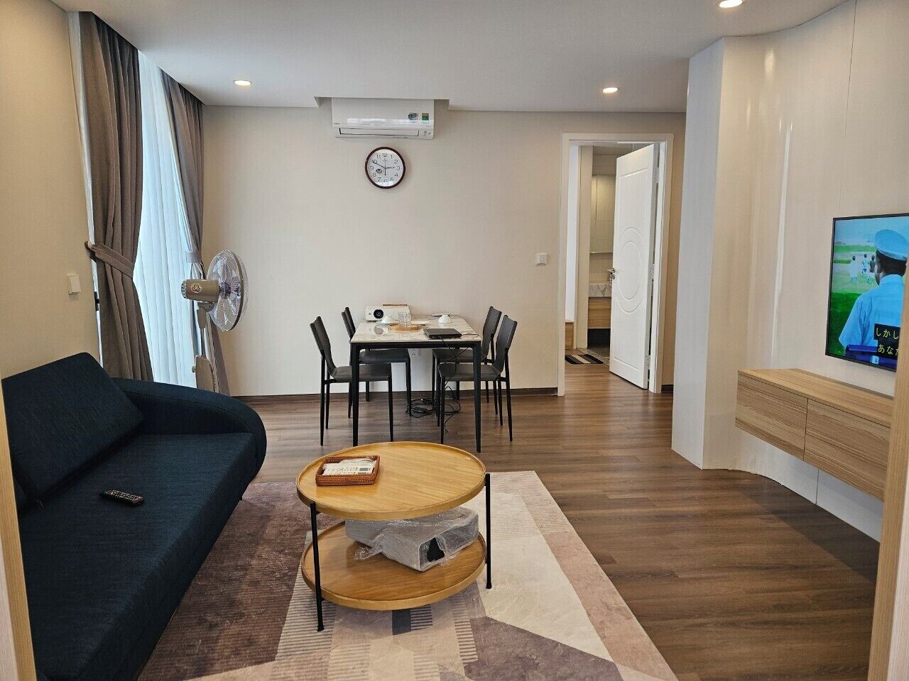 Luxury Apartment | Living area | 50-inch LED TV with satellite channels