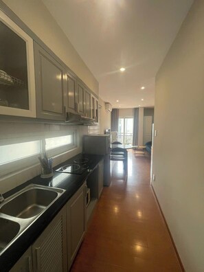 Economy Studio, Balcony, City View | Private kitchen | Fridge, microwave, stovetop, electric kettle - Ruby Serviced Apartment Phan Ke Binh (Hanoi)