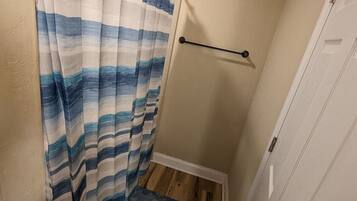 Bathtub, hair dryer, towels, soap