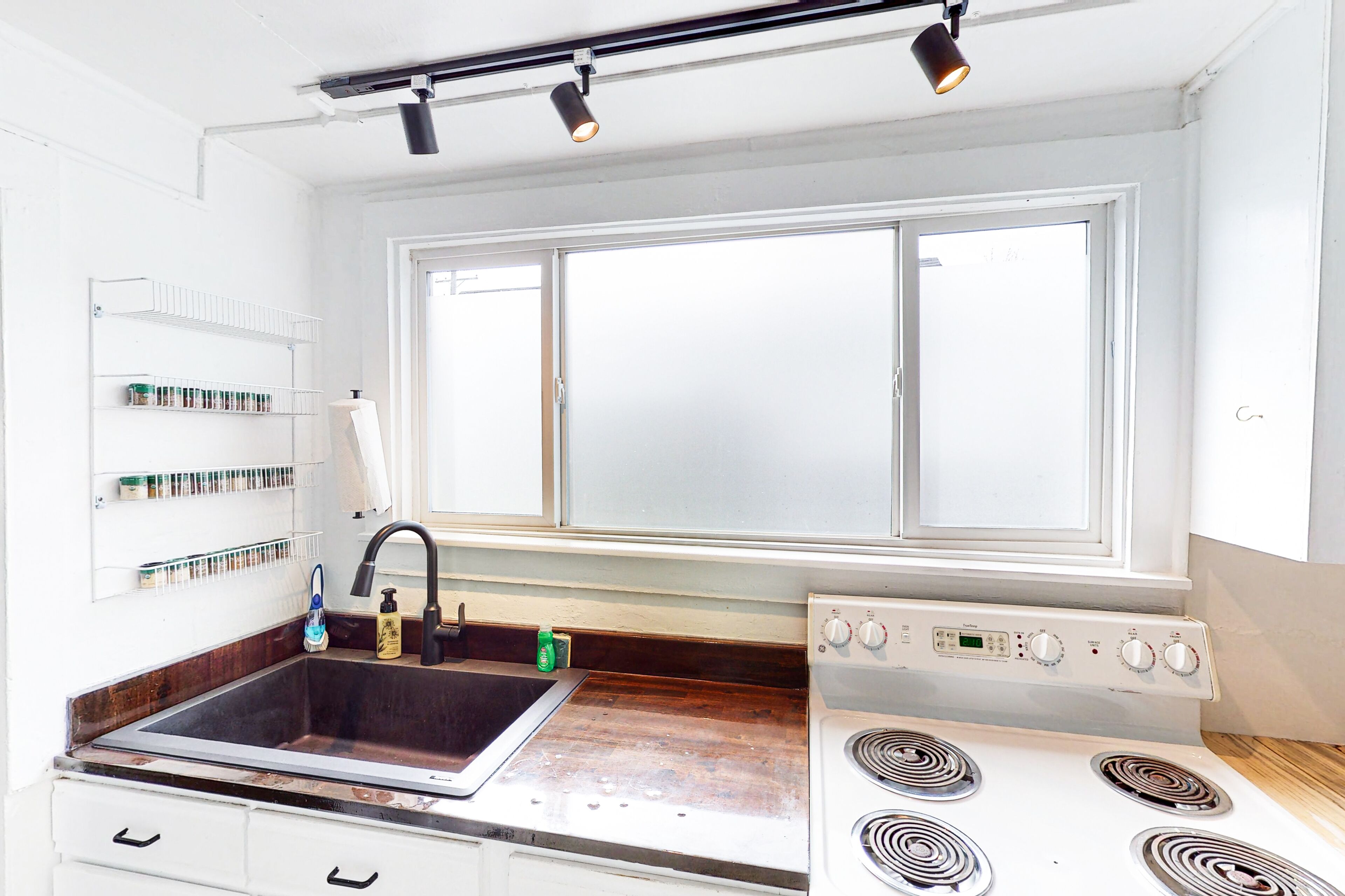 Dog-friendly home in a prime location with fenced yard, full kitchen, & foosball