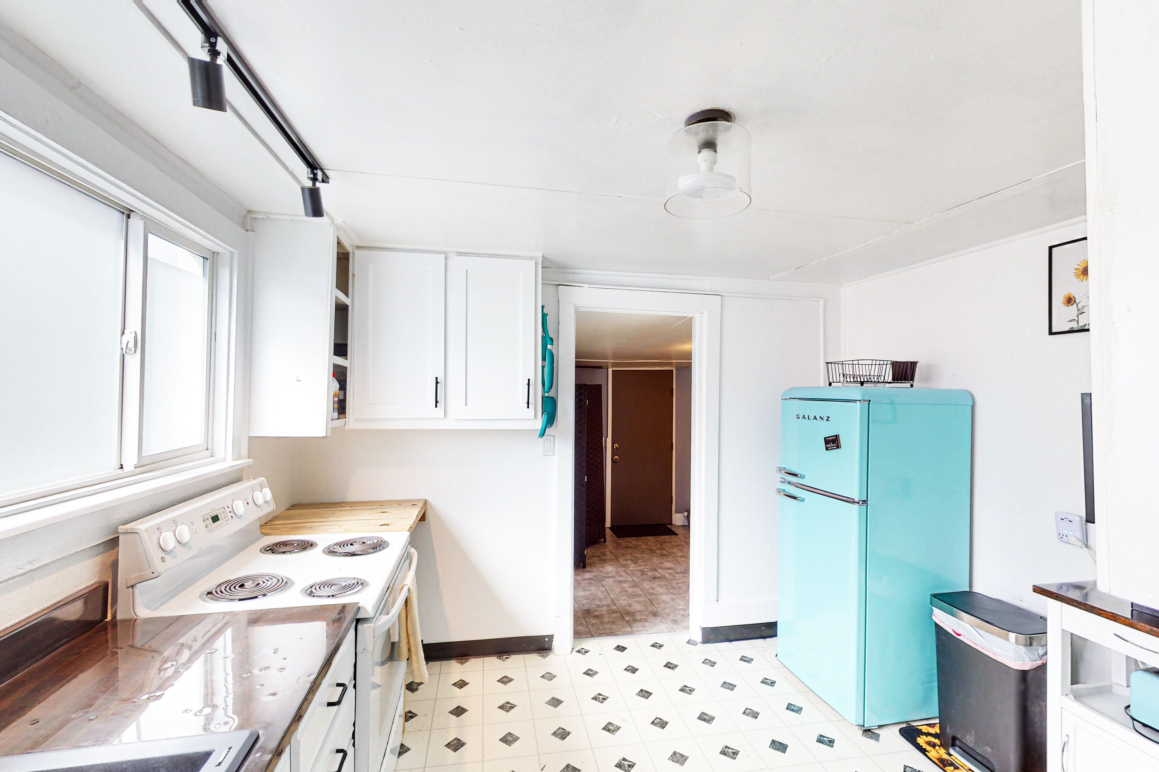 Dog-friendly home in a prime location with fenced yard, full kitchen, & foosball