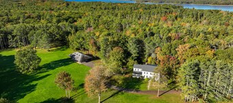 Renovated farmhouse on an acreage with grill, four-bedrooms, & W/D - river views