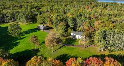 Renovated farmhouse on an acreage with grill, four-bedrooms, & W/D - river views