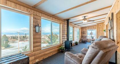 Inviting lake view home with fireplace, golf nearby, full kitchen, & W/D