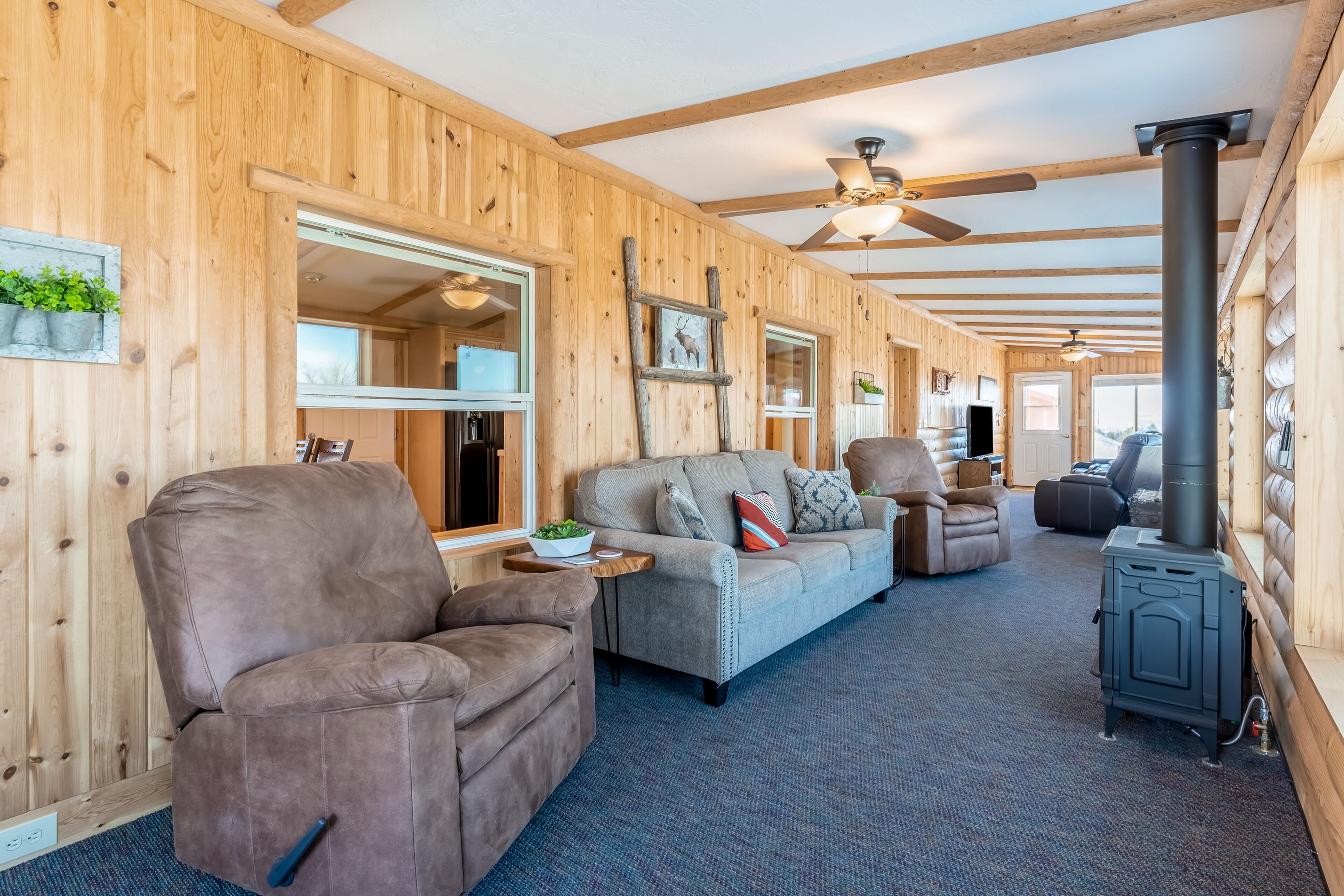 Inviting lake view home with fireplace, golf nearby, full kitchen, & W/D