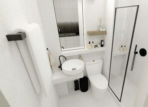 A modern bathroom with a toilet, sink, and shower. - Plagia Relax Hotel (Nea Propontida)