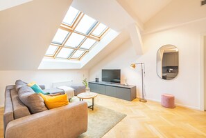 Duplex | Living area | 120-cm Smart TV with satellite channels, streaming services