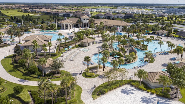 A resort with multiple swimming pools, lounge areas, and a golf course. - Champions Gate 4 BD, Themed, Private Pool 1542 (Davenport)