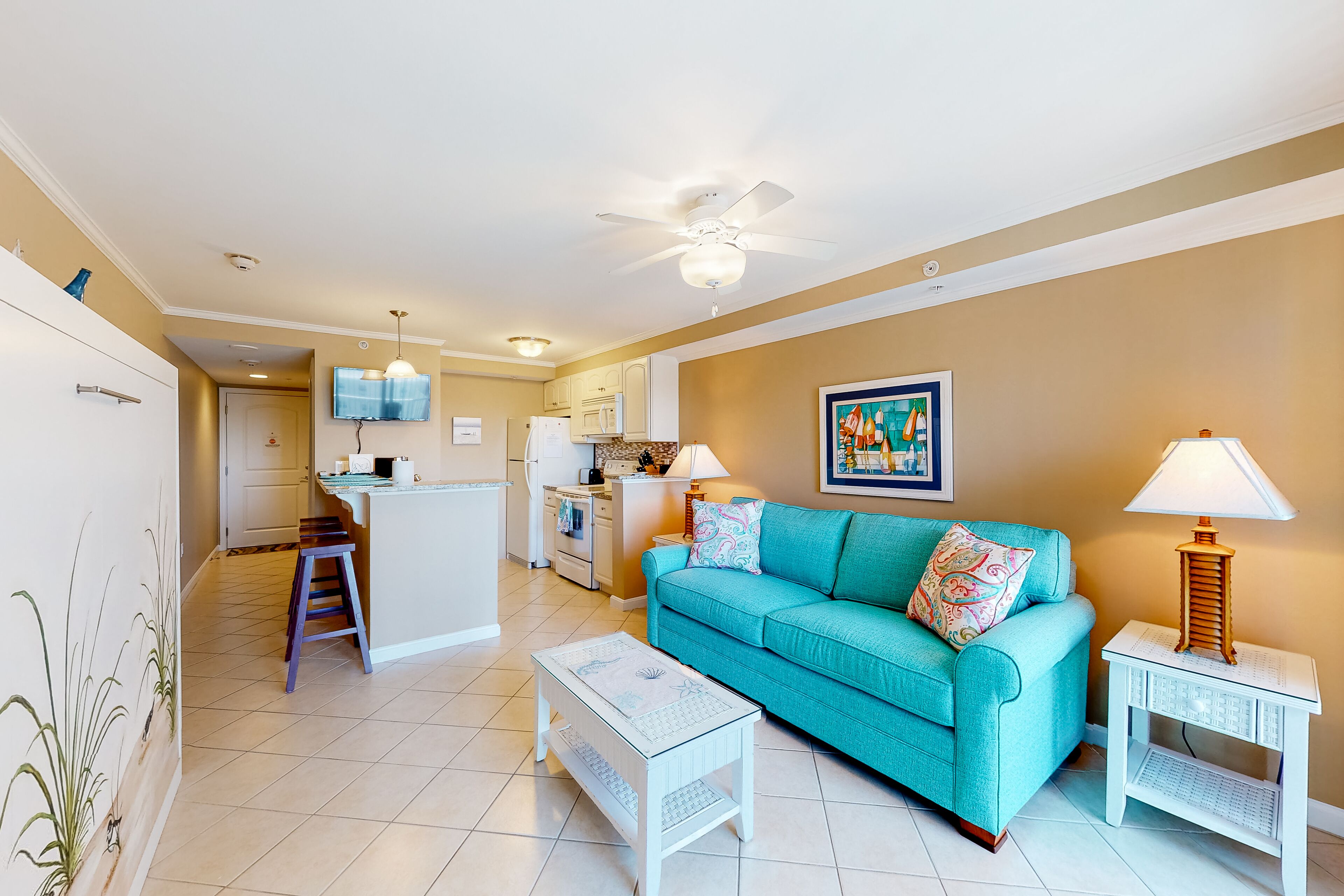 4th-floor studio with partial bay views, heated pool, gym, sauna, balcony, & AC