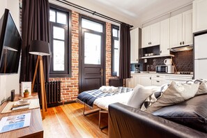 Appartement Classique | Coin séjour | TV connectée, Netflix, services de streaming
