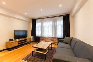 Deluxe-Apartment | Wohnbereich | Smart-TV, Netflix, Streaming-Dienste