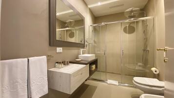 Junior Quadruple Room | Bathroom | Shower, hair dryer, slippers, bidet