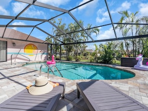 The home has a large heated pool, with new paver deck and new pool cage! - Heated Pool + Game Room + Free EV Charging near Anna Maria Island & IMG Academy (Bradenton)