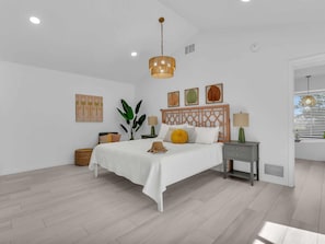 The primary bedroom is spacious and has an en-suite bathroom - Heated Pool + Game Room + Free EV Charging near Anna Maria Island & IMG Academy (Bradenton)