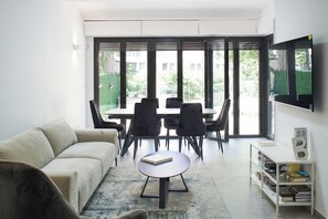 Comfort Apartment | Living area | 43-inch flat-screen TV with cable channels, TV - 2 BR next to Old City with Patio by FeelHome (Jerusalem)