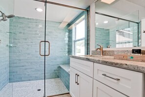 Bathtub, hair dryer, towels, shampoo