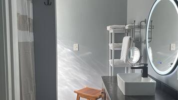 Shower, hair dryer, towels, soap