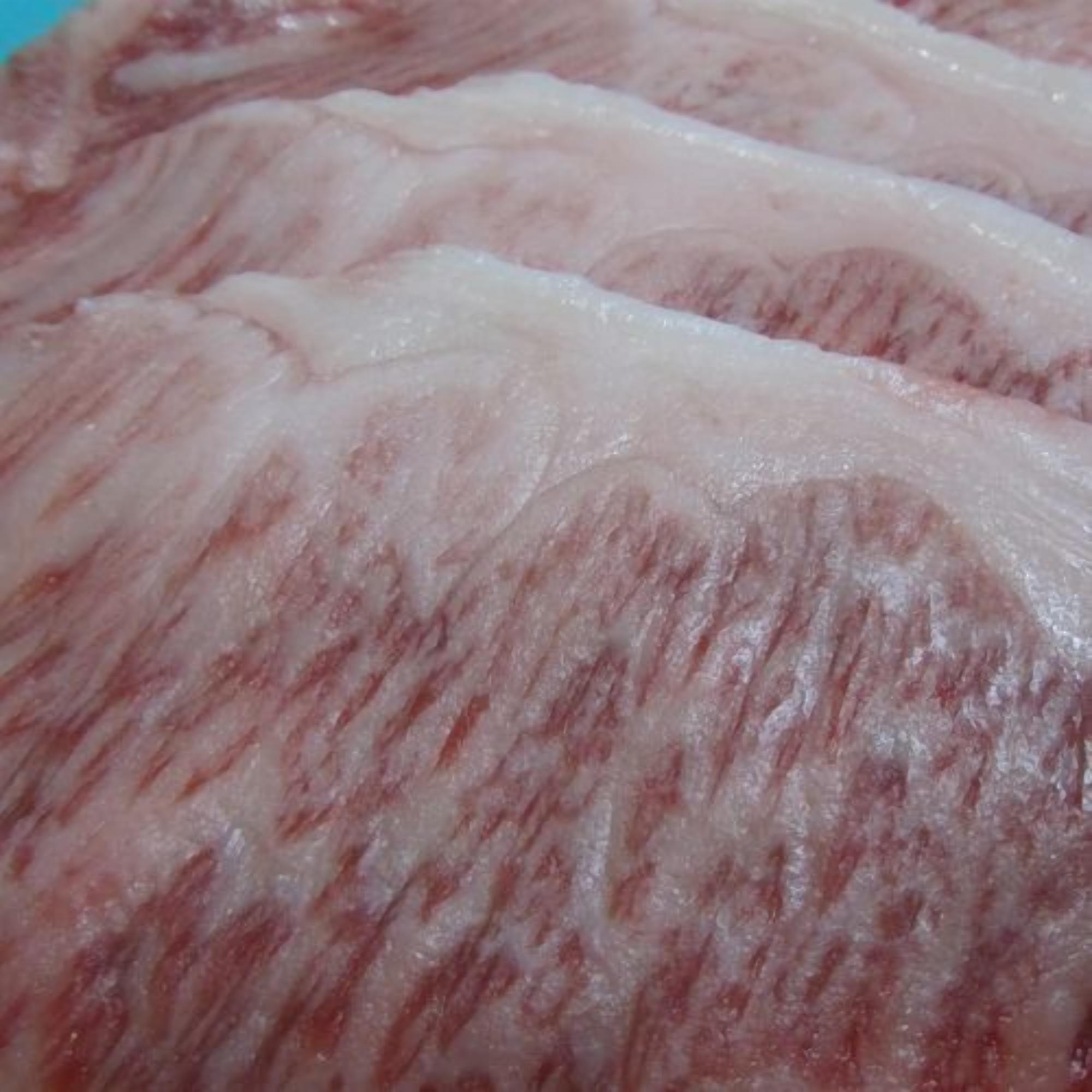 A close-up of a textured surface with a pattern of lines and swirls.