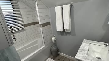 Hair dryer, towels, soap, shampoo
