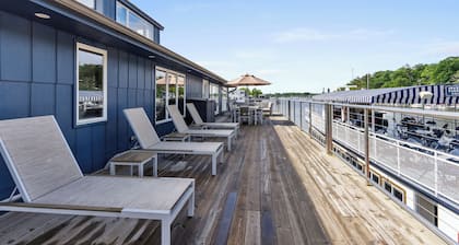 Gorgeous Downtown Penthouse with 40' Waterfront Deck Overlooking Kalamazoo River & Mt. Baldhead! 3BR 2BA (Upper Level Unit)