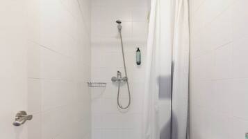 Shower, hair dryer, towels, shampoo