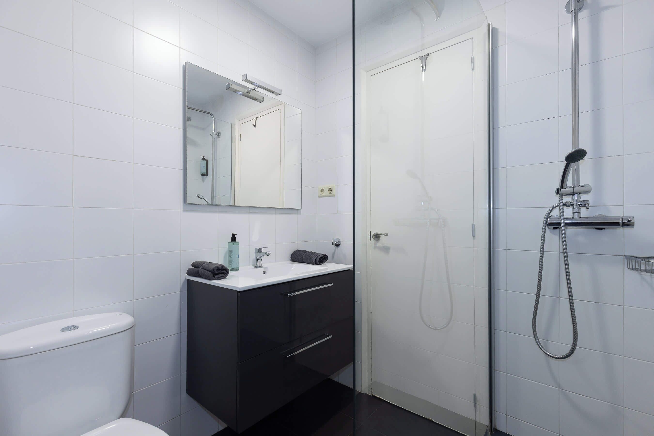Shower, hair dryer, towels, shampoo