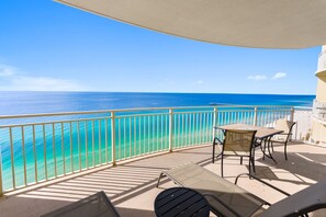 A balcony with a view of the ocean, a table, and two chairs. - Aqua 2008 - Gulf-Front Escape, Sleeps 6, Beach Service (Panama City Beach)