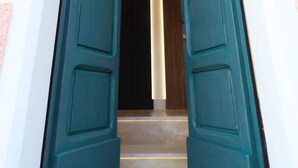 A doorway with teal doors leading to a staircase. - Hidden GEM- luxurious holiday STUDIO Garibaldi-for couples (Olbia)