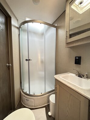 Shower, towels, soap, shampoo
