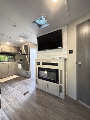 Microwave, dishwasher, coffee/tea maker, dining tables