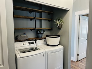 Convenient laundry facilities with washer and dryer, plus storage for essentials.