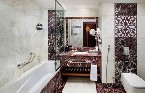 Bathtub, hair dryer, bathrobes, slippers