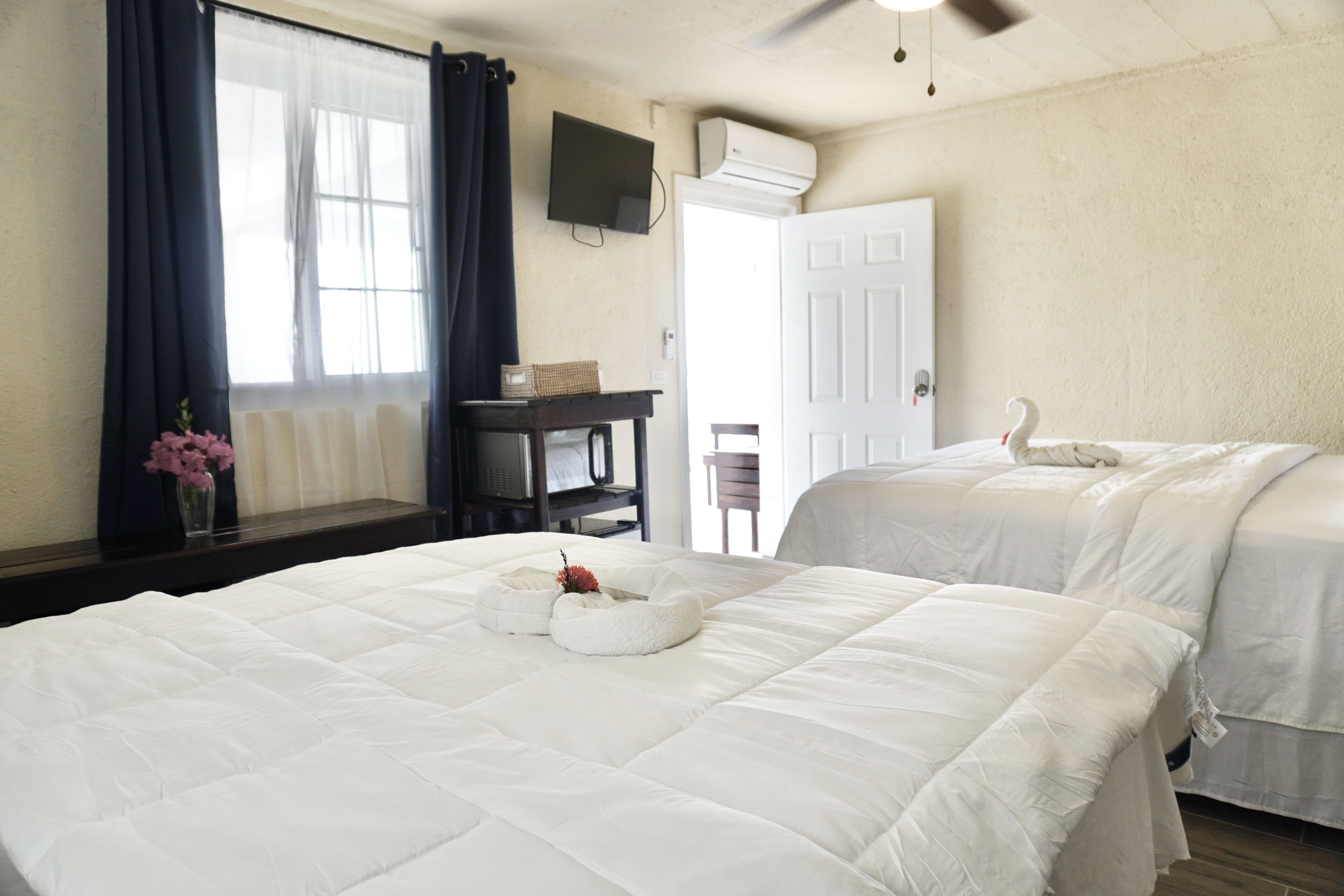 double room, 2 queen beds, ocean view | in-room safe, desk, blackout curtains, iron/ironing board