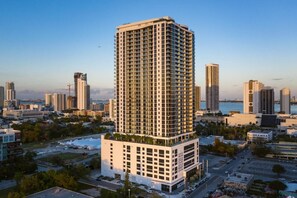 Standing tall in the heart of the city, this high-rise building offers stunning views of the urban landscape.
