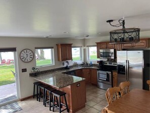 Fridge, microwave, oven, dining tables - The Noquebay Hideaway (Wausaukee)