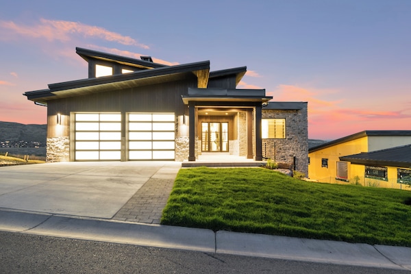 Spacious garage and driveway with total parking for 4 full size vehicles