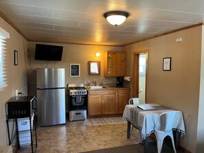 Classic Cabin | Private kitchen | Full-sized fridge, microwave, oven, stovetop