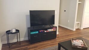 Relax in this cozy living space with a flat-screen TV and ample storage.