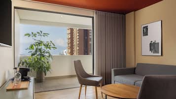 Suite, 1 King Bed with Sofa bed, City View | Premium bedding, in-room safe, blackout drapes, soundproofing