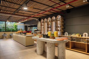 A modern kitchen with a central island, bar area, and seating. - Loma, Medellin, a Tribute Portfolio Hotel (Medellín)