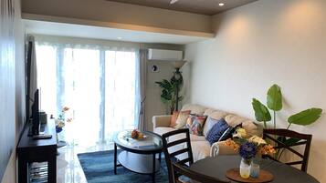 Basic Apartment, 1 Bedroom, Ocean View | Living area | Flat-screen TV