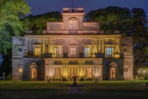 A large, historic building with a symmetrical facade, large windows, and a central entrance. - Palacio Santa Candida (Concepción del Uruguay)