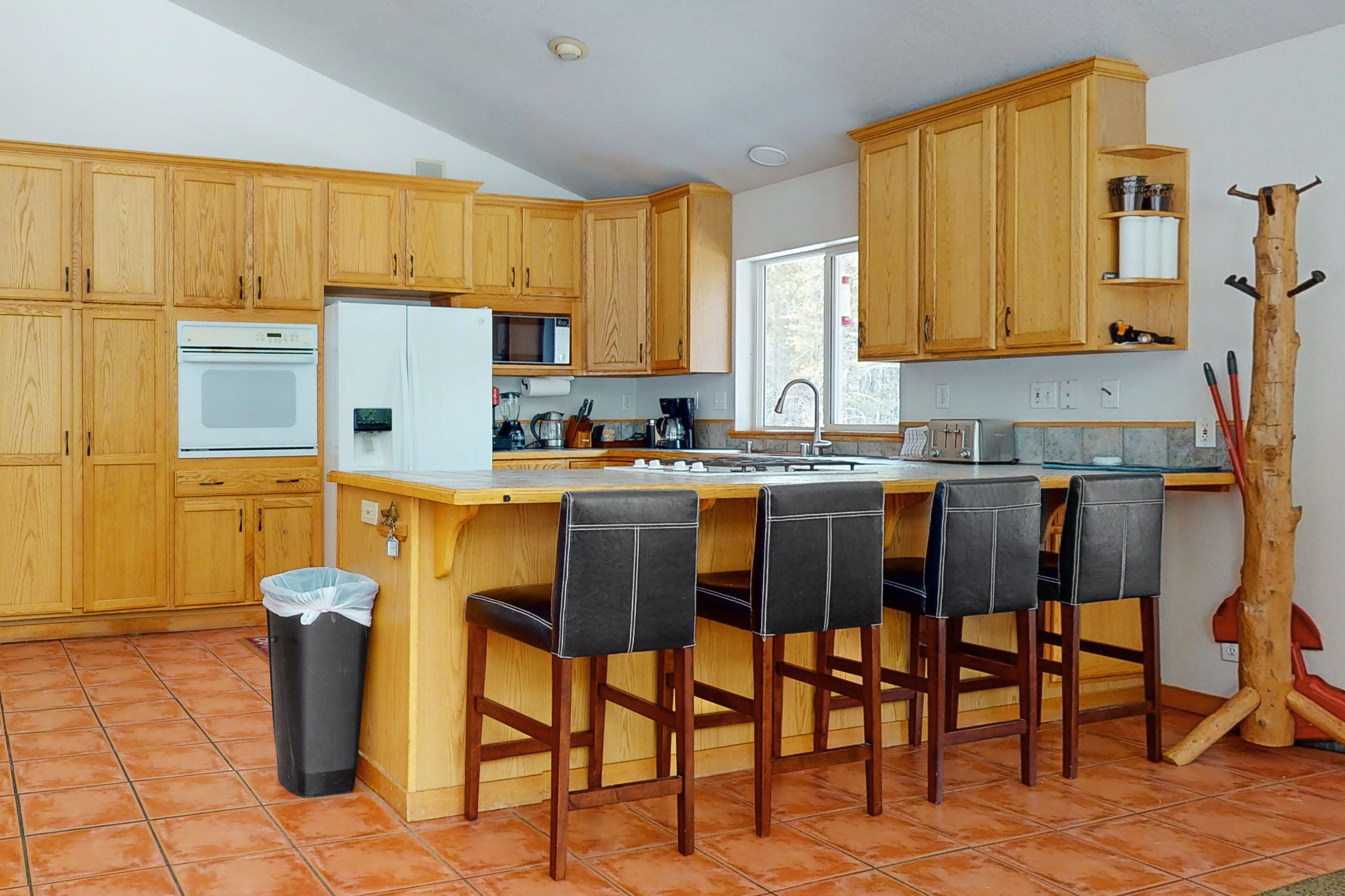 Dog-friendly home with large deck, hot tub, woodstove, W/D, & serene setting
