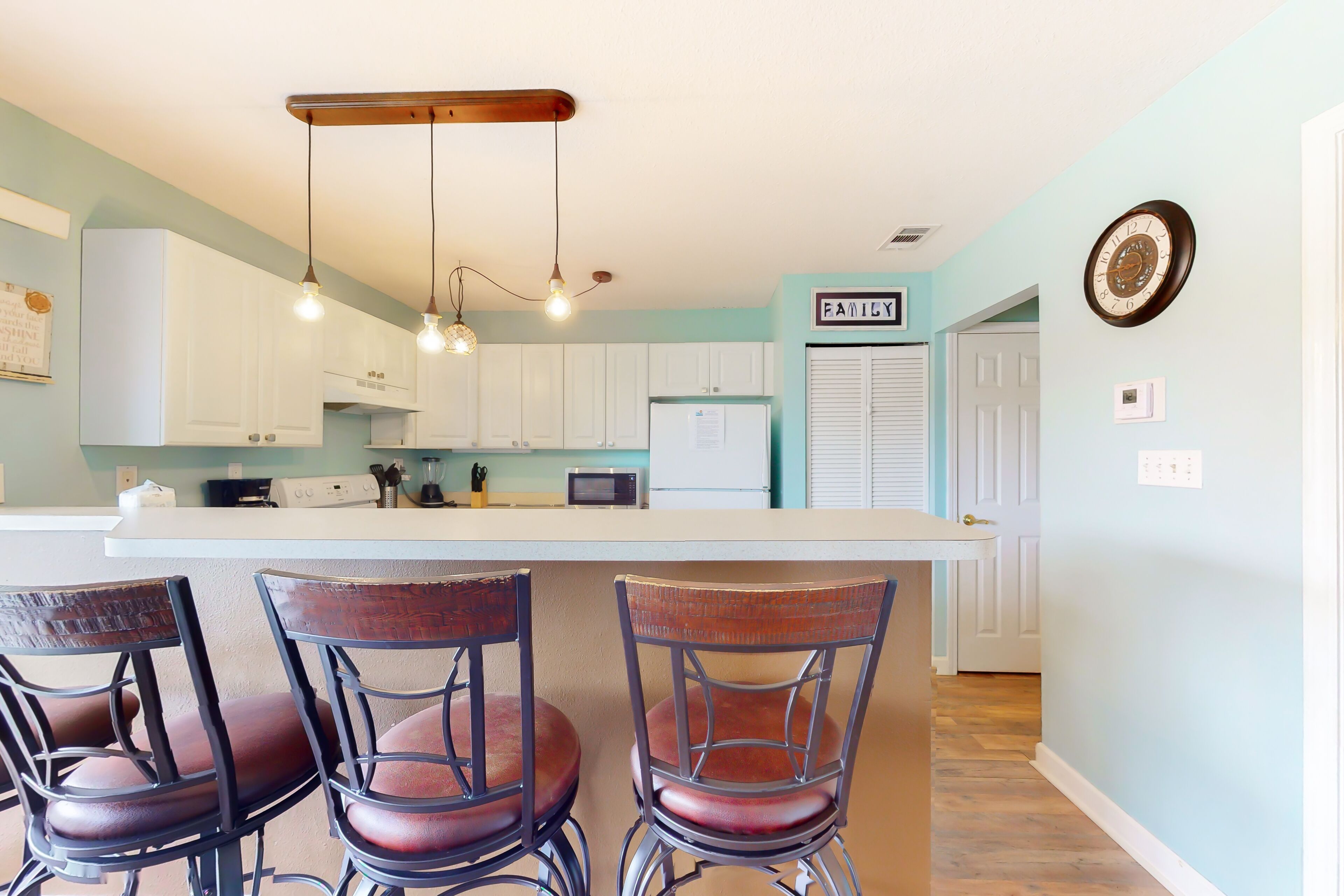 Centrally located condo with a palm-view balcony & W/D - pool and tennis access