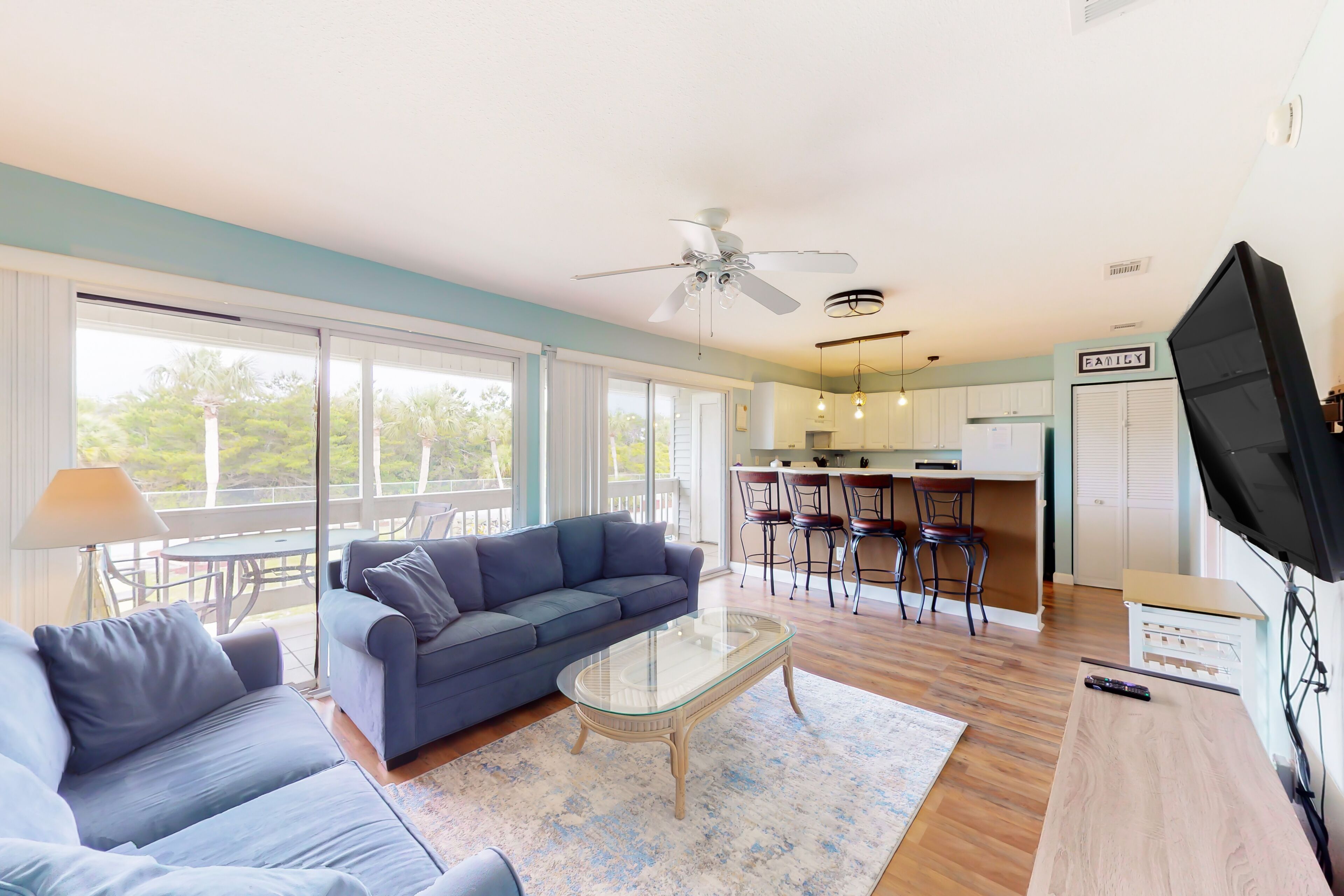 Centrally located condo with a palm-view balcony & W/D - pool and tennis access