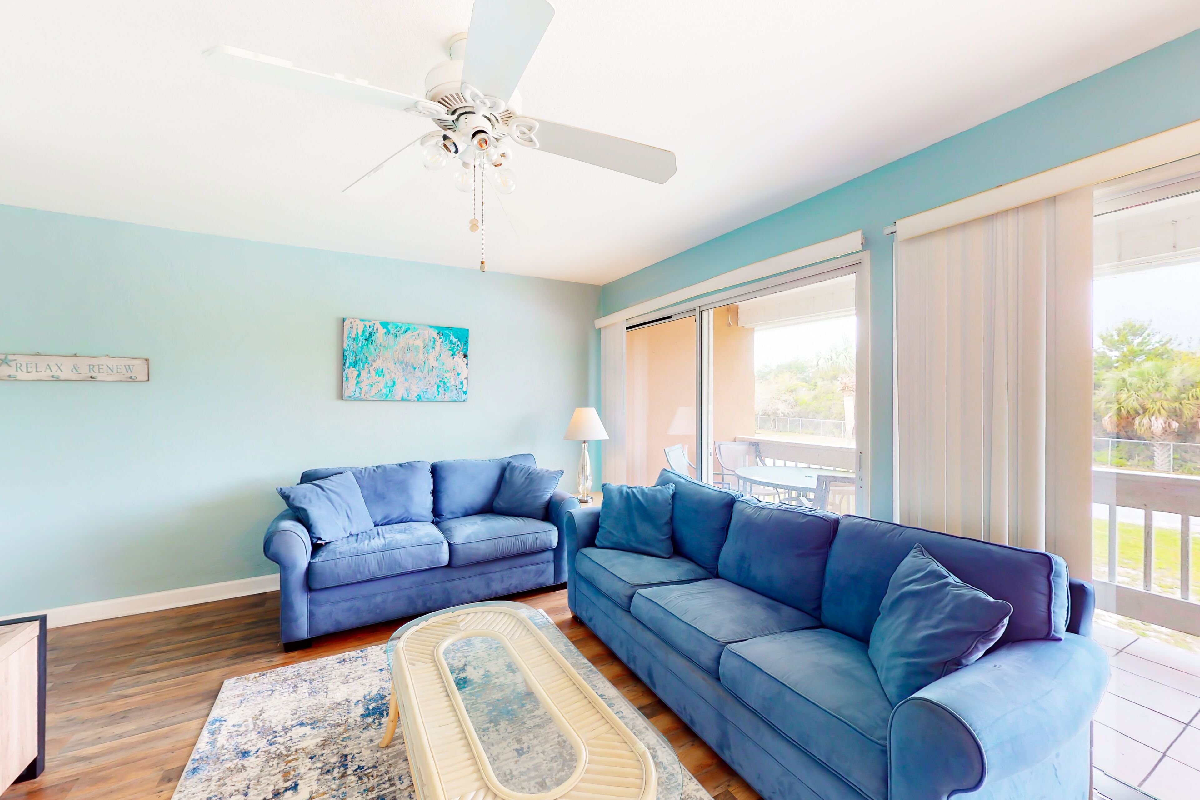 Centrally located condo with a palm-view balcony & W/D - pool and tennis access