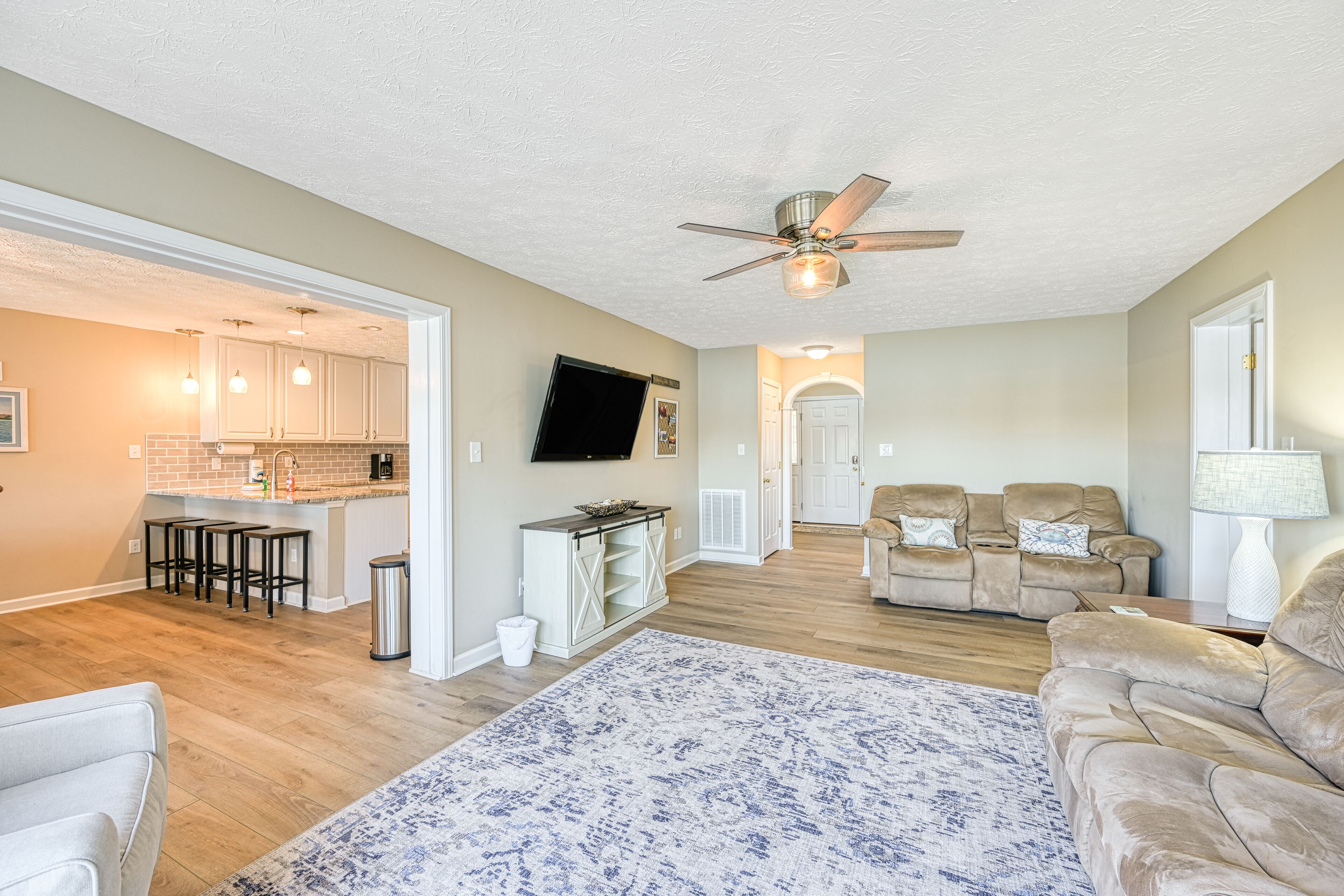 Serene lakefront home with dock, patio, grill, hot tub, pool table, & W/D